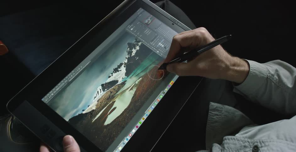 A man is drawing on a tablet