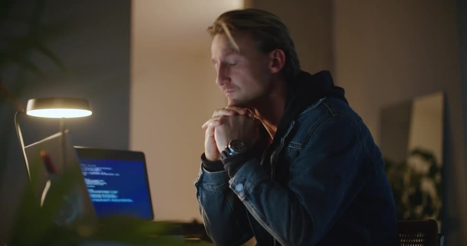 A man is looking at his computer