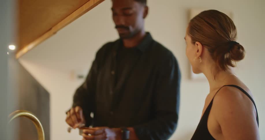 A couple cook in the kitchen together