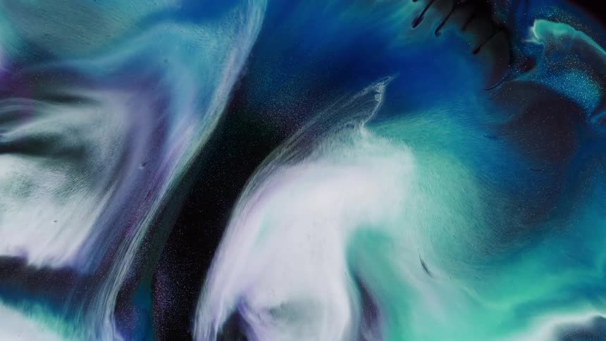Shades of blue mix and swirl together as they expand outward