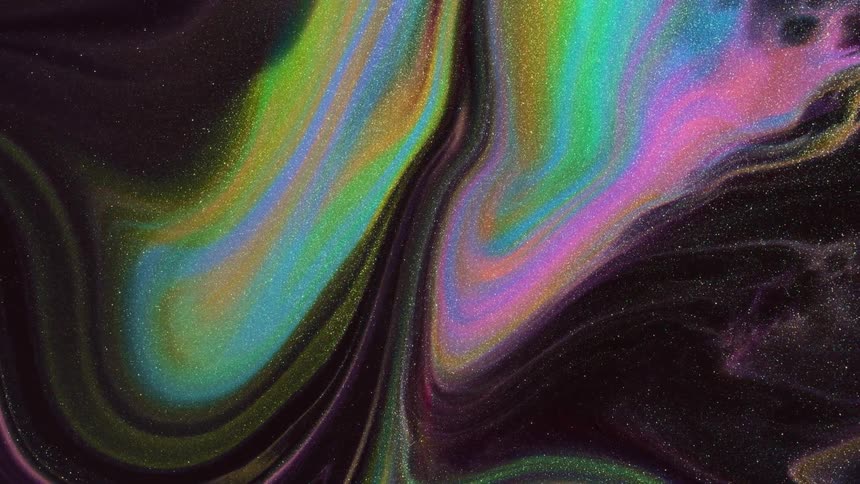 multicolored marbling shape expands and floats in the night sky