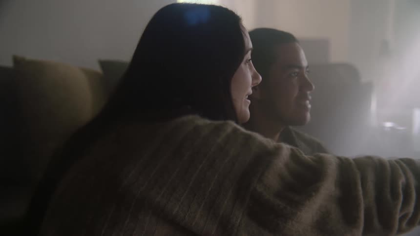 Parents are playing with their son
