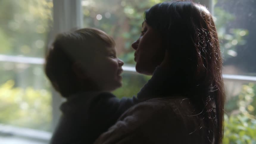 A mother holds her son