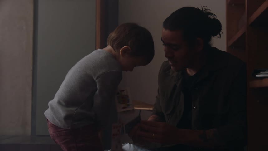 Father and son are hanging out with each other indoors