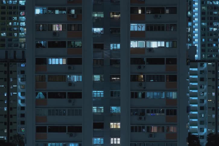 Time lapse of the night lights turning on apartment buildings