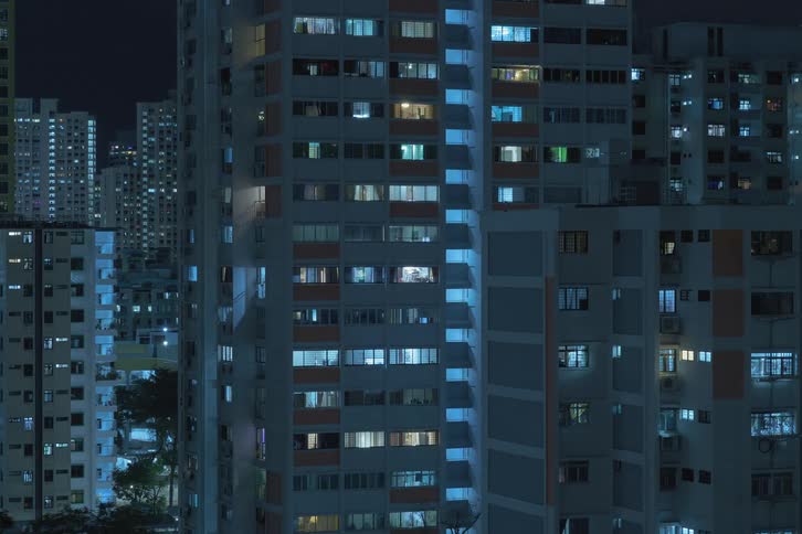 Building lights turn on downtown
