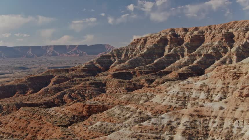 An aerial view of a desert plateau with various ridges formed by erosion