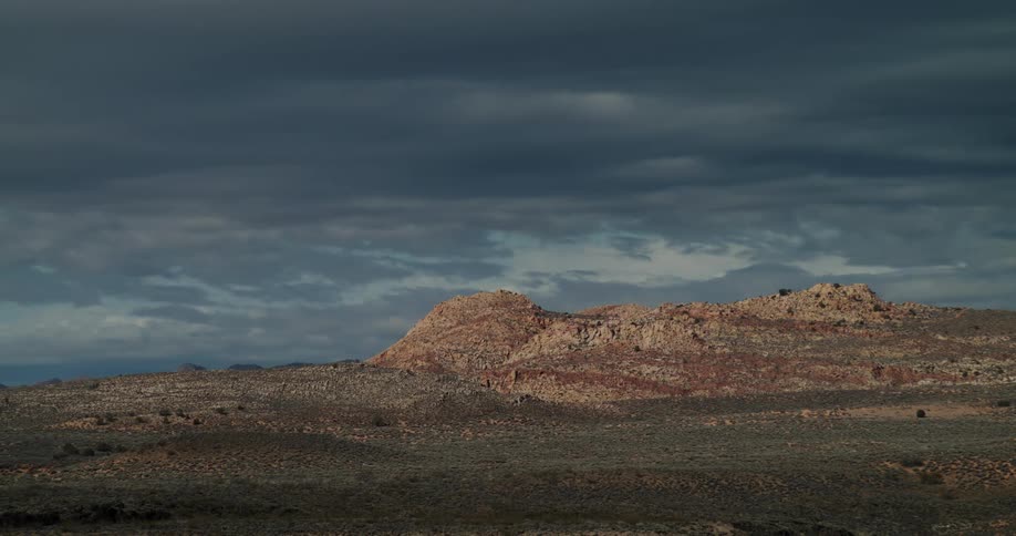Landscape of rocky desert as storm clouds begin to build
