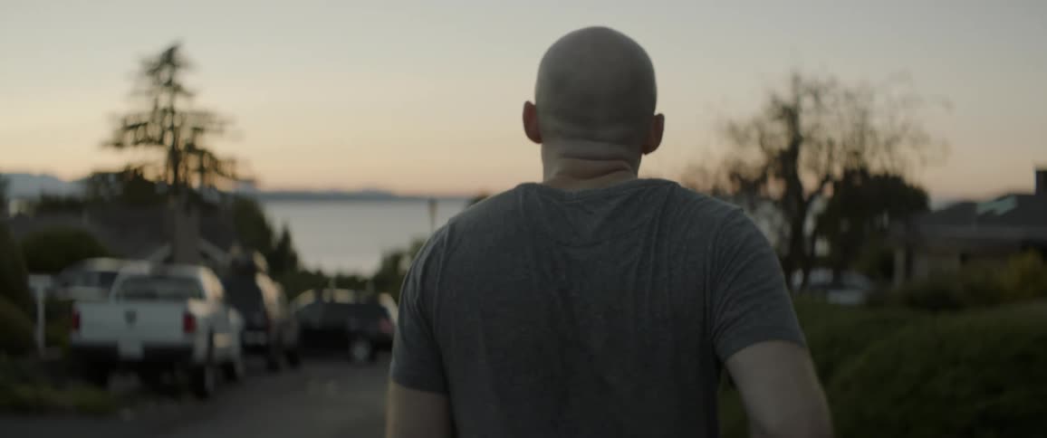 A man jogs outside at sunset