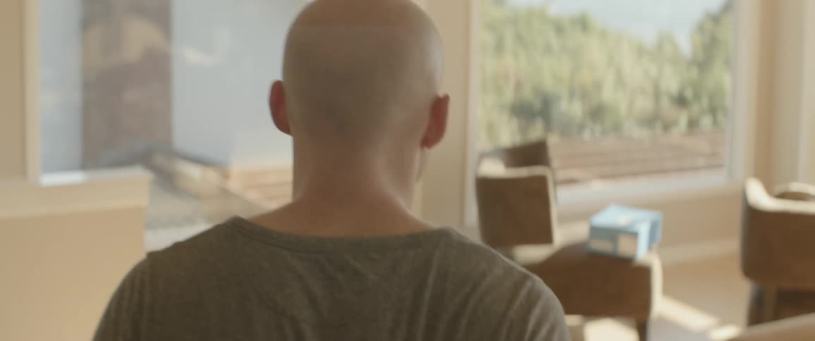 The man walks fast in his living room
