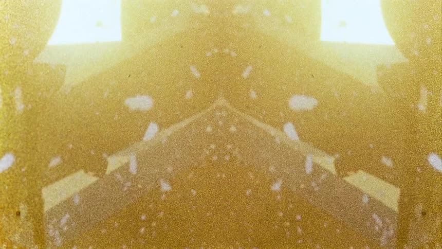 Image of tv monitor playing vintage rocket launch footage with refractive grating effect