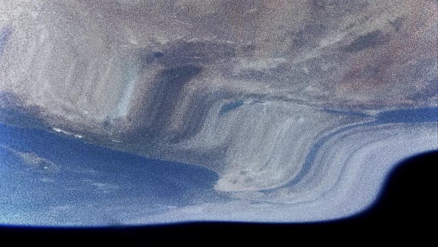 Disorted footage of the mass lands on planet earth seen from space