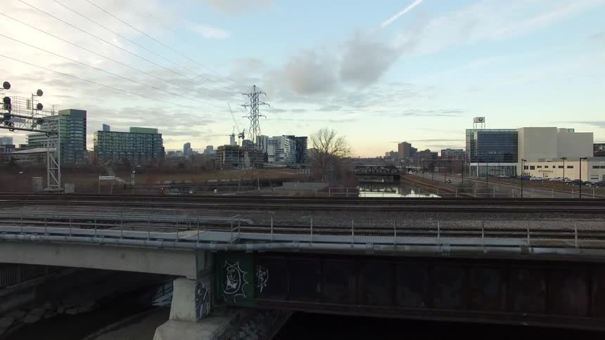 Moving over train tracks going over a canal