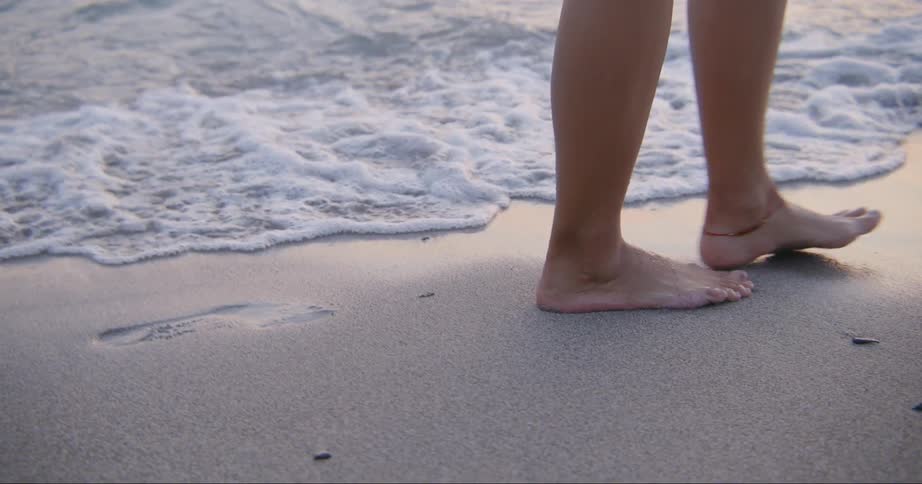 A person walking on the beach