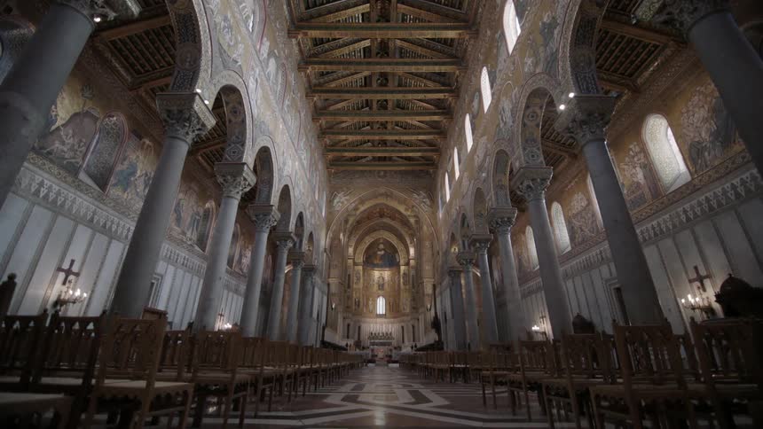 A large church is lined with pillars
