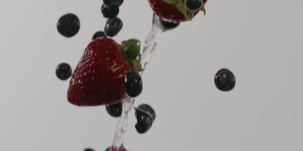 Berries and water fly through the air