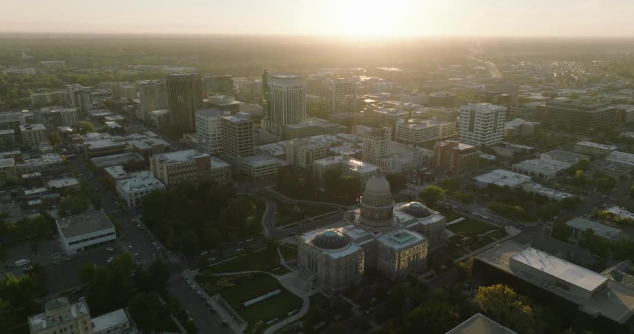 Aerial view of government building and apartment buildings at sunset in the city