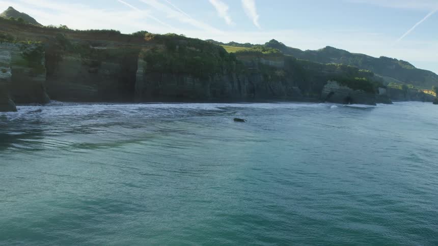 An aerial view of a waterway surrounded by cliffs