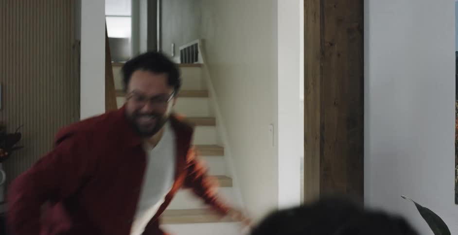 A man is chasing a woman around