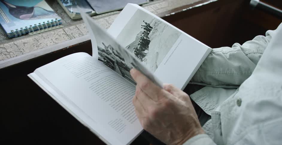 A person is flipping through a book