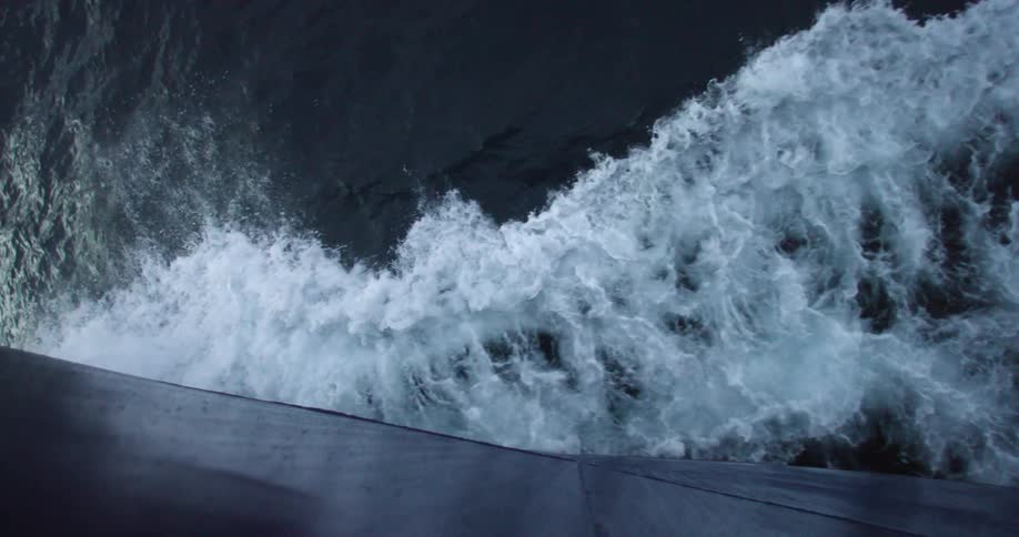 Waves crash onto a surface