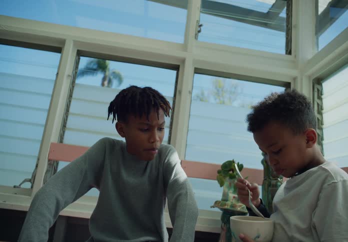 A child eats cereal at home