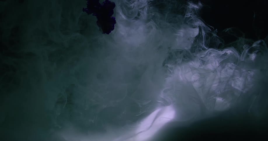 A cloudy liquid looks like smoke as bands of light pass over it
