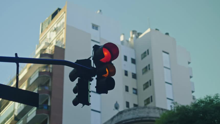 A street light is displayed in an urban city