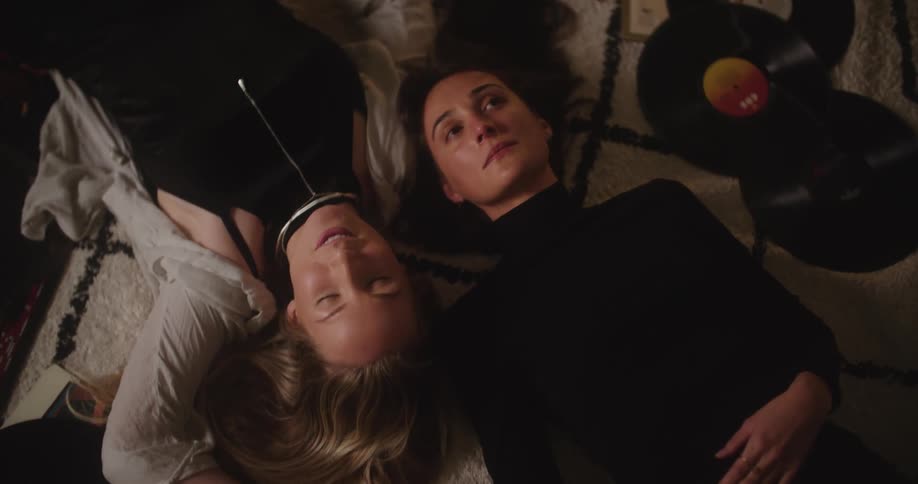 Two friends laying around talking