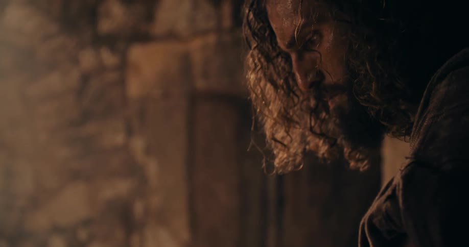 A man is chiseling stone