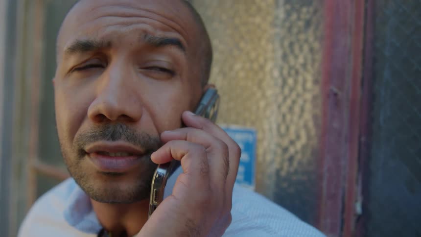 A man using a smartphone outdoors