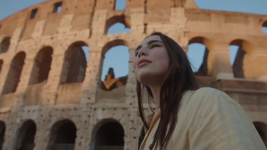 A woman is touring some ruins
