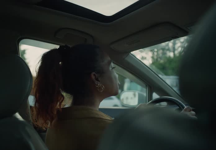 Interior view of black woman driving a vehicle
