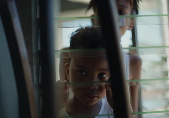 Two children look in the window