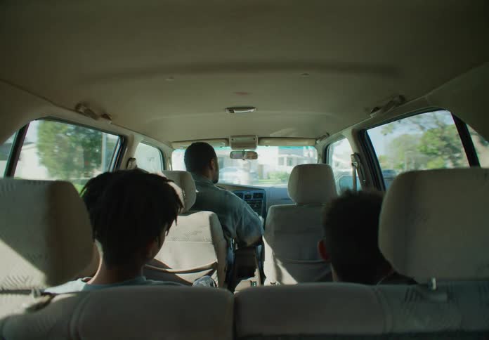 A family driving in a van together