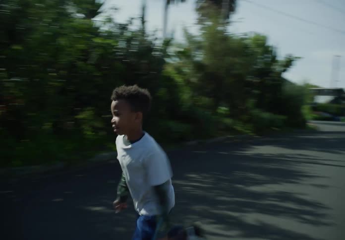 A child runs into the driveway