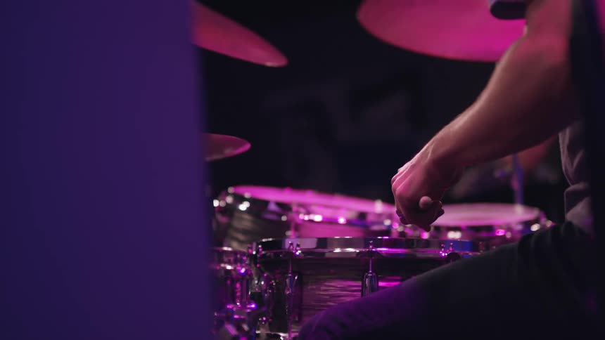 A man plays the drums