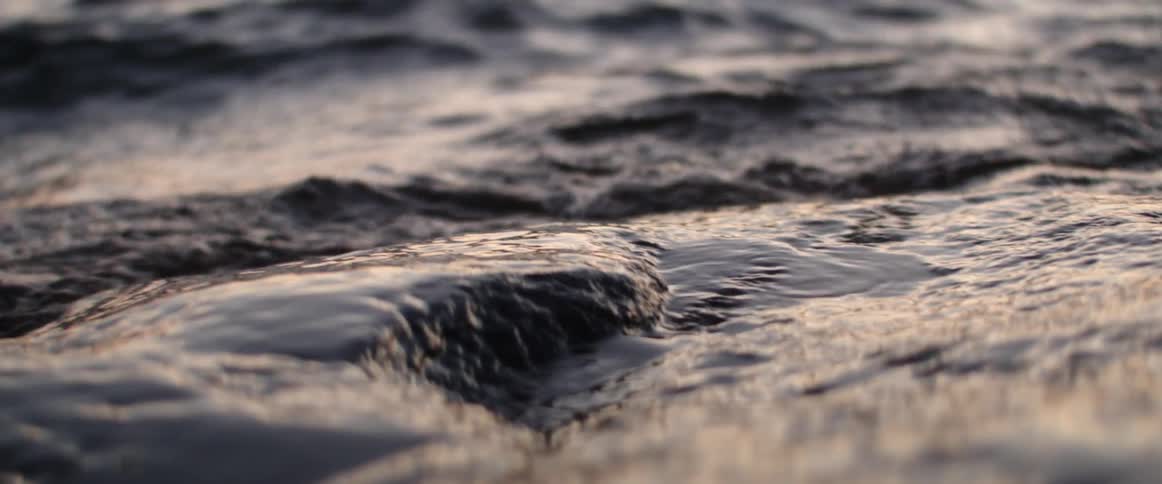 Waves roll over the beach
