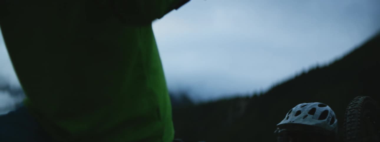 Men Hiking with Mountain Bikes at Sundown