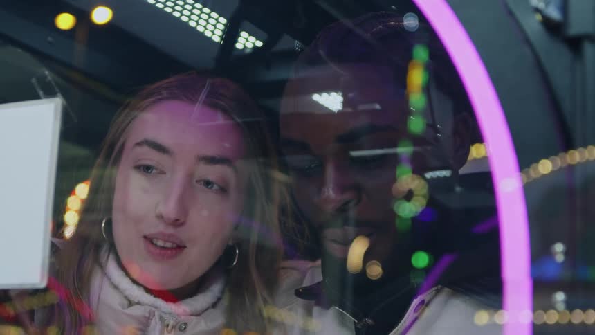 A couple play a game in an arcade