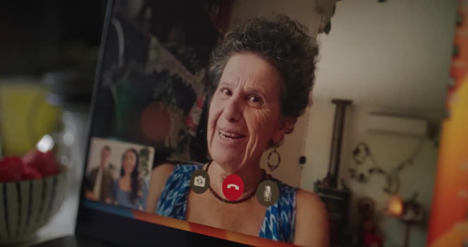 Man and woman make video call on laptop laughing
