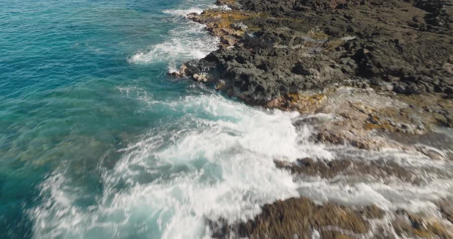 Aerial view of rocky shore and ocean waves