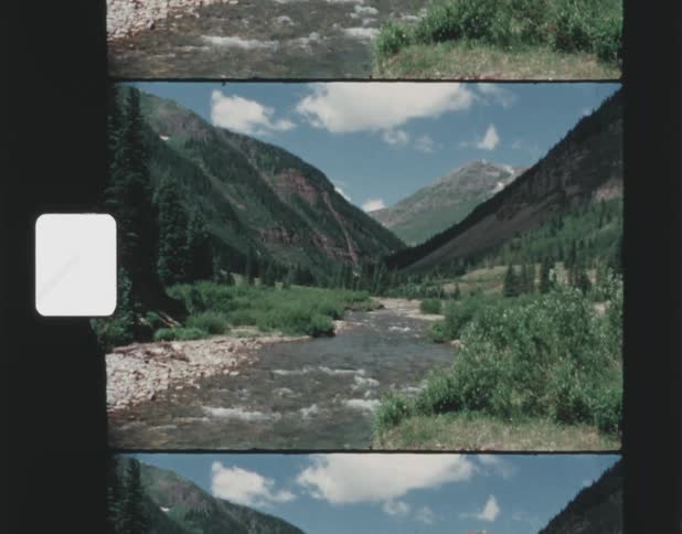 A small stream runs through the mountains