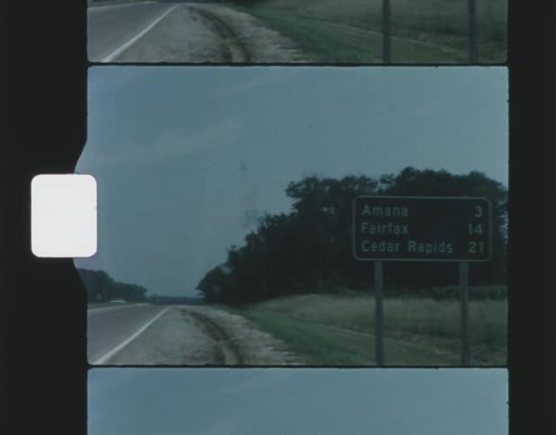 A sign is on the side of the highway