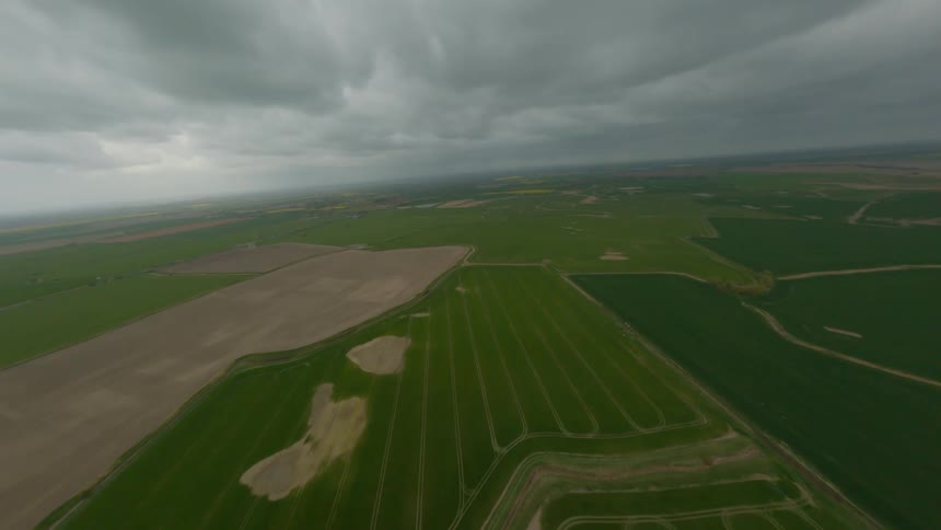 The long fields are covered with heavy clouds