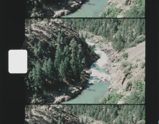 Aerial view of river flowing down a valley
