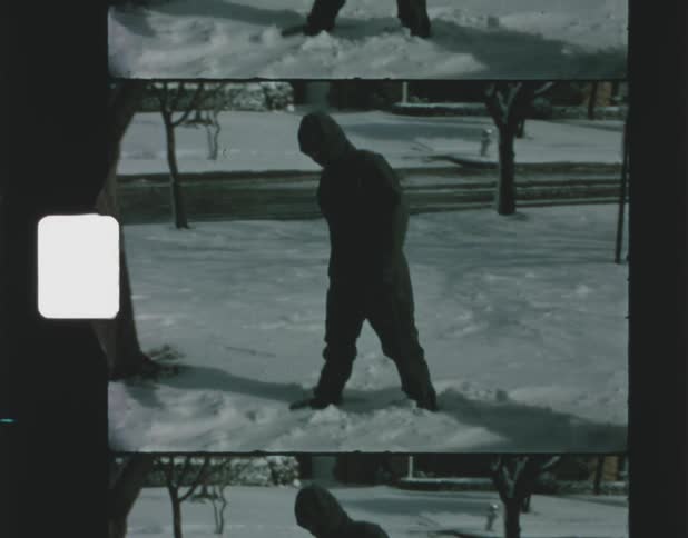 A man walking outdoors in the snow