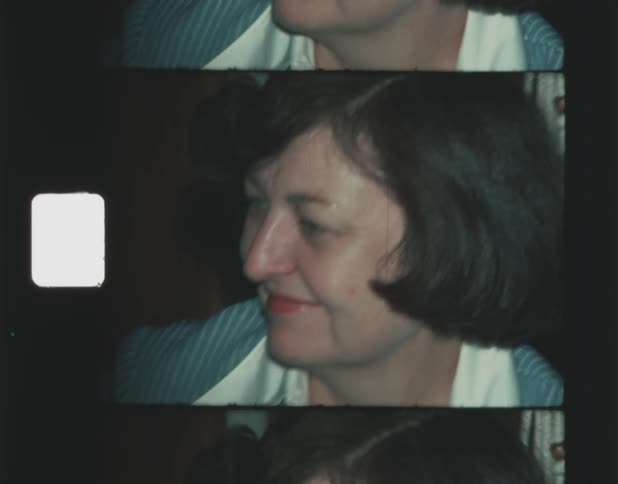 A woman is smiling