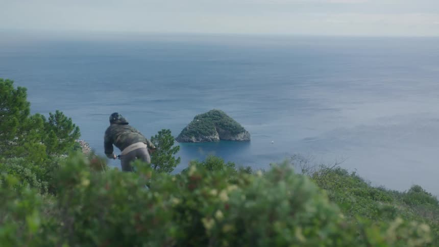 A person riding a mountain bike down a hill