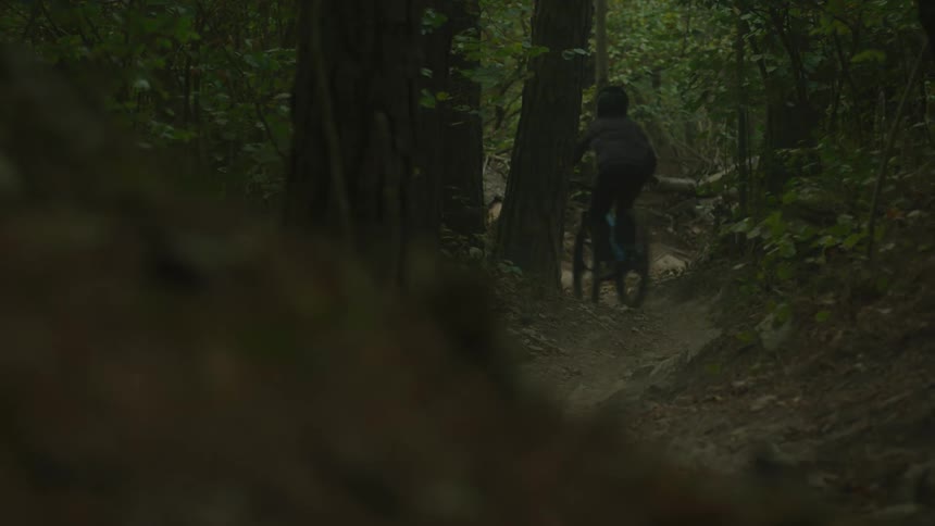 A man riding a mountain bike outdoors